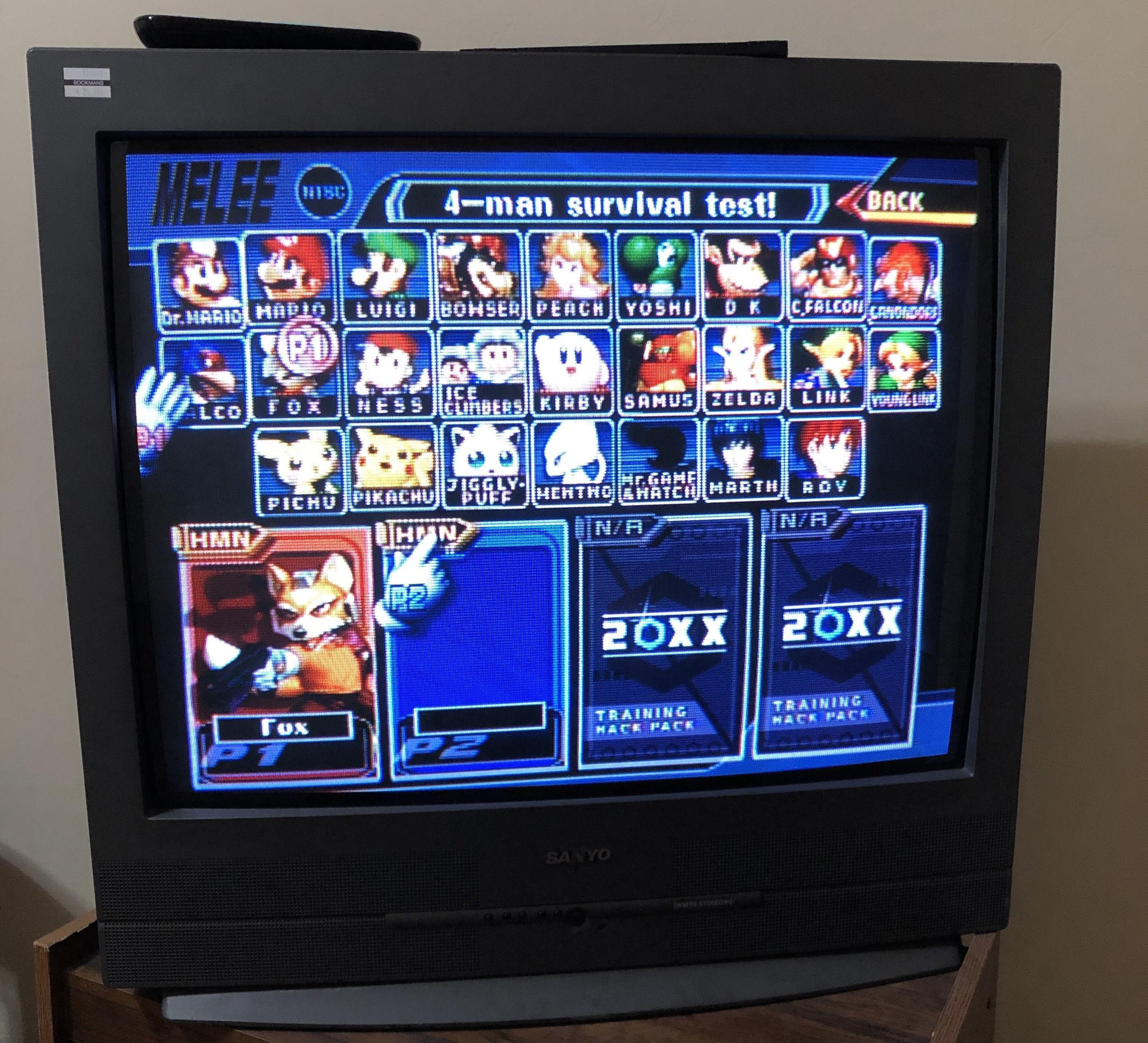 Competitive Super Smash Brothers Melee tournament setup with CRT televisions