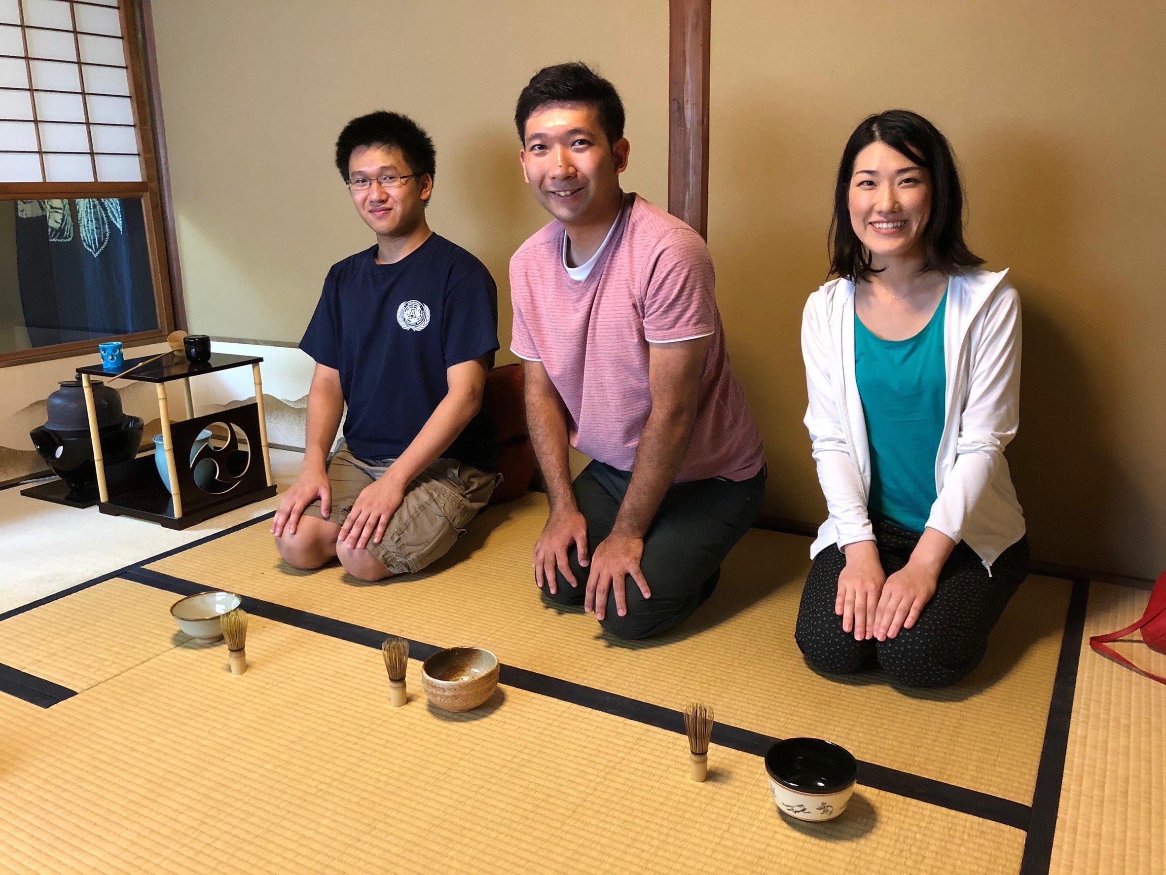 Ryan and two others kneeling on tatami at a Japanese tea ceremony
