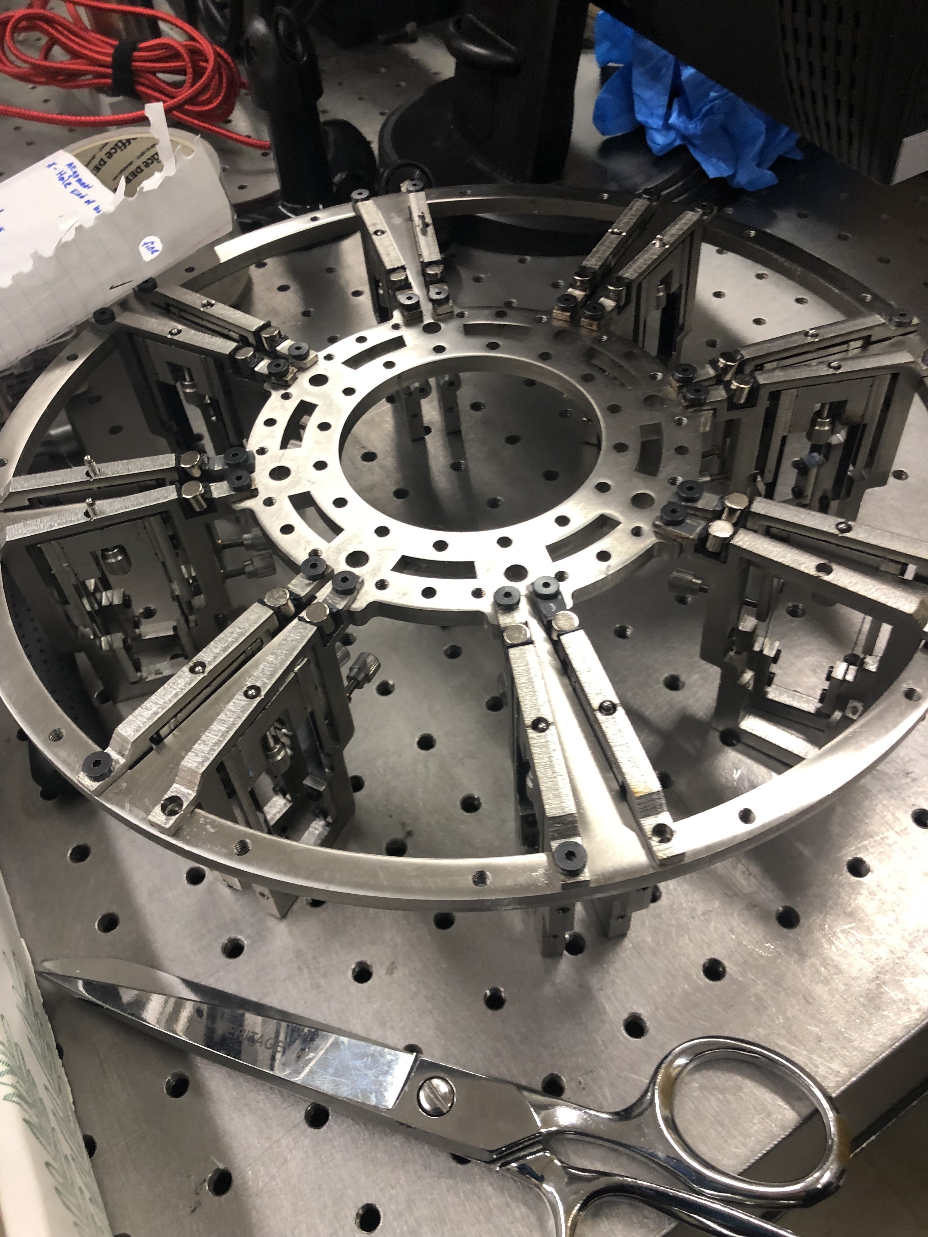 Frame with KEYS on optical table, lens segments being installed